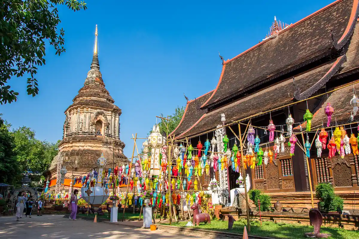 Paper lanterns hanging in a temple courtyard in Chiang Mai during Yi Peng